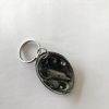 Zinc Paua shell with Dolphin inside keyring